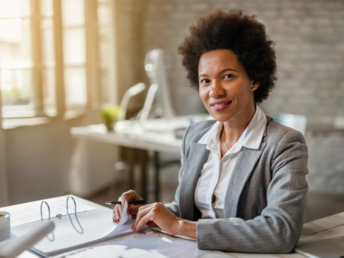 Accounting professional at her desk reviewing documents