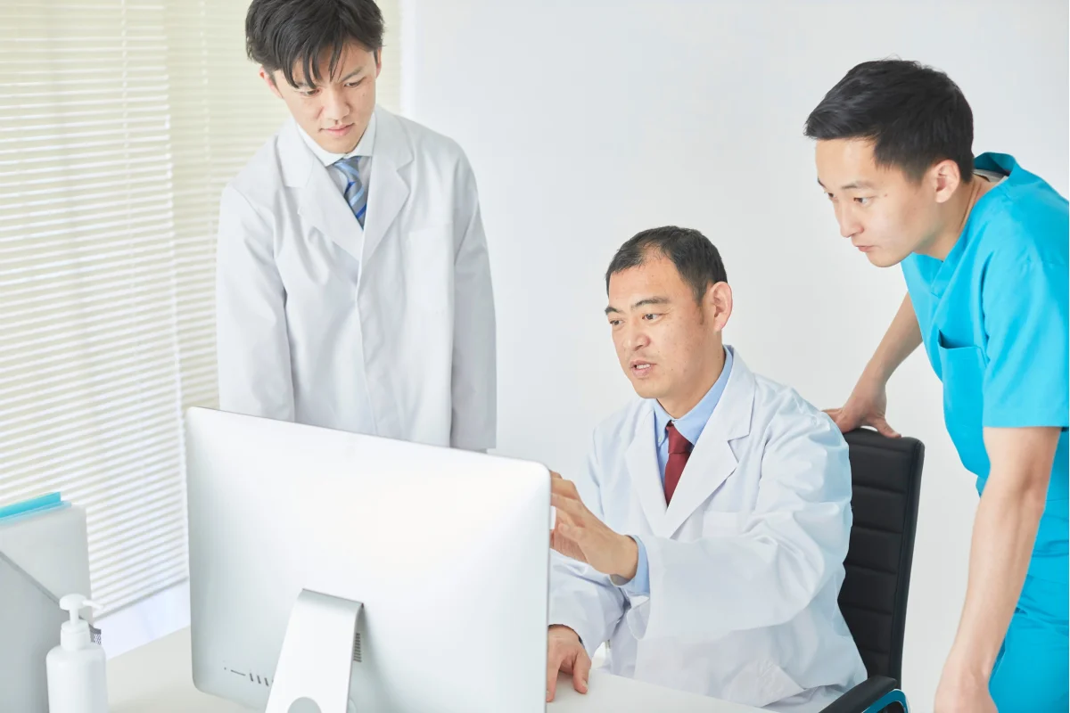 Medical team reviewing patient data on a computer